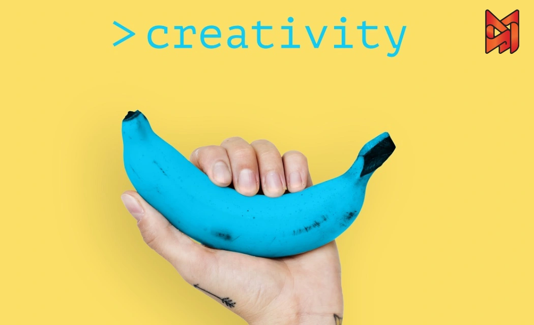 A bold and surreal visual featuring a blue banana with dynamic splashes of color, symbolizing out-of-the-box thinking in creative advertising.