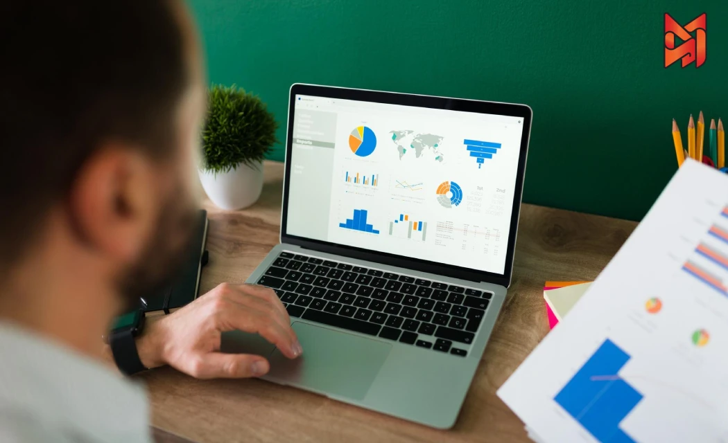 A performance marketer creating a presentation with graphs showing campaign success rates.