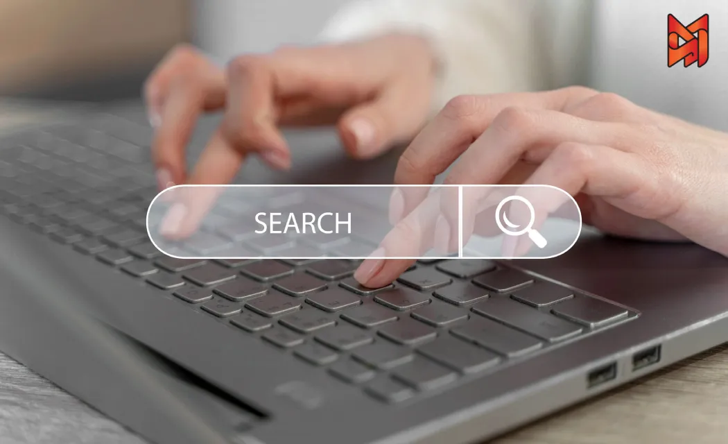 SEO specialist conducting keyword research on a laptop.