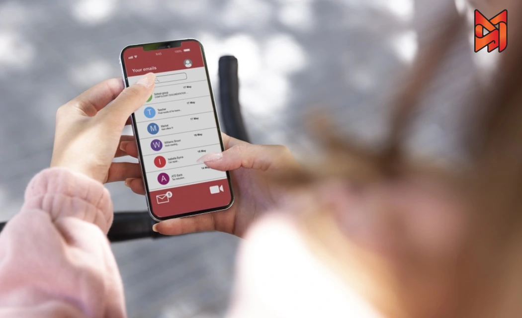 A person checking a marketing email on a smartphone.