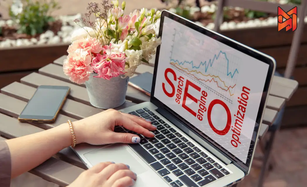 A SEO professional typing on a laptop with on-page SEO elements like graphs for better analyzing.