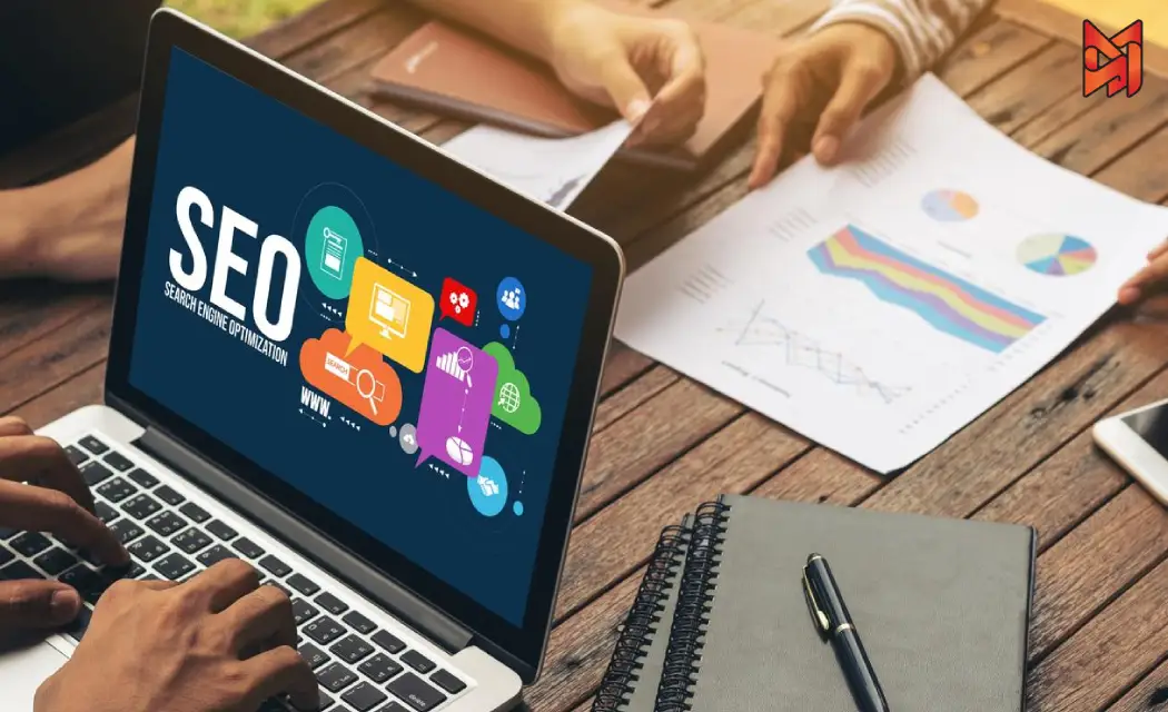 SEO team members using SEO Audit Tools to scan a website, reviewing data and charts.