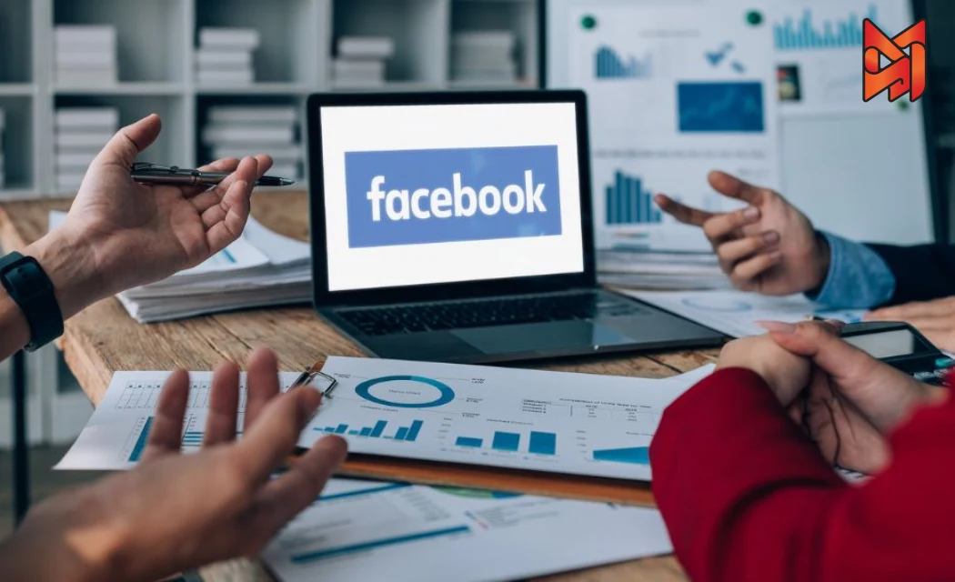 PPC team analyzing performance data to improve Facebook Ads copywriting during a meeting.
